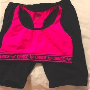 Black jogger pants with a hot pink top